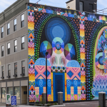 Image: Detail photograph of a colorful mural by Saya Woolfalk on the side of a building in Cincinnati, OH